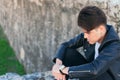 Sad handsome young man outdoors sad, thoughtful and reflective Royalty Free Stock Photo