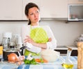 Sad housewife cooking dinner Royalty Free Stock Photo