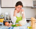 Sad housewife cooking dinner Royalty Free Stock Photo