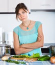 Sad housewife cooking dinner Royalty Free Stock Photo