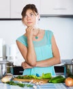 Sad housewife cooking dinner Royalty Free Stock Photo