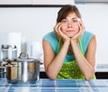 Sad housewife cooking dinner Royalty Free Stock Photo