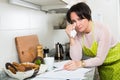 Sad housewife reading bills and crying Royalty Free Stock Photo