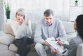 Sad husband and wife talking to psychotherapist Royalty Free Stock Photo