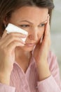 Sad ill beautiful young woman posing at home Royalty Free Stock Photo