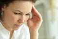 Close up portrait of sad ill young woman at home with headache Royalty Free Stock Photo
