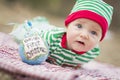 Sad Infant Baby On Blanket With Babys First Christmas Ornament