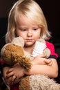 Sad injured boy with stuffed dog toy Royalty Free Stock Photo