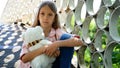 Sad Kid in Park, Unhappy Thoughtful Child Outdoor, Bored Pensive Girl on Bridge Royalty Free Stock Photo