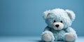 sad light blue teddy bear, on a blue background, blue monday, copy space, banner