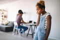 Sad little girl waiting for busy parent attention at home Royalty Free Stock Photo