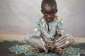 Sad little African boy Looking at Camera with Blurred Background Royalty Free Stock Photo