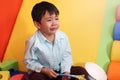 Sad little Asian boy crying, Asian kid getting upset and bad-tempered at the playground Royalty Free Stock Photo