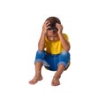 Sad little asian boy sitting on floor isolated on white background