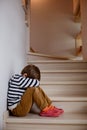Sad little boy crying depressed sitting Royalty Free Stock Photo