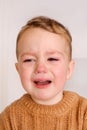 Sad little boy is crying. Toddler child has stress, pain and is tired. Royalty Free Stock Photo