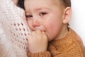 Sad little boy is crying. Toddler child has stress, pain and is tired. Mother comforting her crying boy. Royalty Free Stock Photo