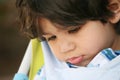 Sad little boy with head down Royalty Free Stock Photo