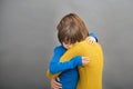 Sad little child, boy, hugging his mother at home, isolated image Royalty Free Stock Photo