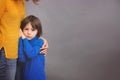 Sad little child, boy, hugging his mother at home, isolated image Royalty Free Stock Photo