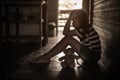 Sad Little child girl sitting near teddy bear with lonely .Low key style Royalty Free Stock Photo