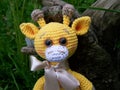 Sad little crocheted giraffe, pessimism. Handmade, toy, amigurumi.