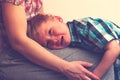 Sad little crying boy hugging his mother at home Royalty Free Stock Photo