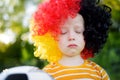 Sad little german child crying over her national football team's loss