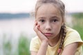 Sad little girl is crying and  looking with serious face at camera Royalty Free Stock Photo