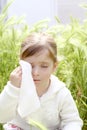 Sad little girl crying outdoor green meadow field Royalty Free Stock Photo