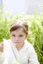 Sad little girl crying outdoor green meadow field Royalty Free Stock Photo