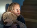 Sad little girl embracing her teddy bear - feels lonely Royalty Free Stock Photo