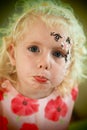 Sad little girl face painting Royalty Free Stock Photo