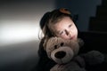 Sad little girl holding her teddy bear Royalty Free Stock Photo