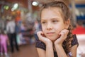 Sad little girl in market Royalty Free Stock Photo