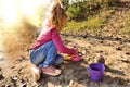 Sad  Little girl  playing on sand with toys alone and away from everyone.  problem of communication Royalty Free Stock Photo
