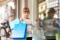 Sad little girl pointing to shop window Royalty Free Stock Photo