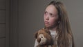 Sad little girl praying while holding a teddy bear in her hands. The teenager seeks protection from God. A lonely child Royalty Free Stock Photo