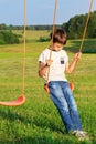 Sad lonely boy sitting on swing Royalty Free Stock Photo