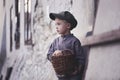 A sad, lonely boy on the street of the old town. Royalty Free Stock Photo