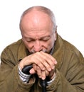 Sad lonely elderly man with a cane posing in studio Royalty Free Stock Photo