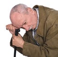Sad lonely elderly man with a cane posing in studio Royalty Free Stock Photo