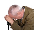 Sad lonely elderly man with a cane posing in studio Royalty Free Stock Photo