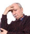 Sad lonely elderly man posing in studio on a white background Royalty Free Stock Photo