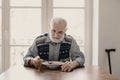 Sad lonely senior man eating soup in empty apartment Royalty Free Stock Photo