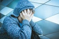 Sad, lonely, unhappy, disappointed child holding head with hands Royalty Free Stock Photo