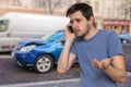 Sad man is calling to assistance after car accident Royalty Free Stock Photo