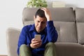 Sad man checking mobile Royalty Free Stock Photo