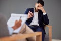 Sad man consulting therapist in therapy or counseling for mental health, depression or stress help, advice and support Royalty Free Stock Photo