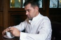 Sad Man drinking coffee in a cafe Royalty Free Stock Photo